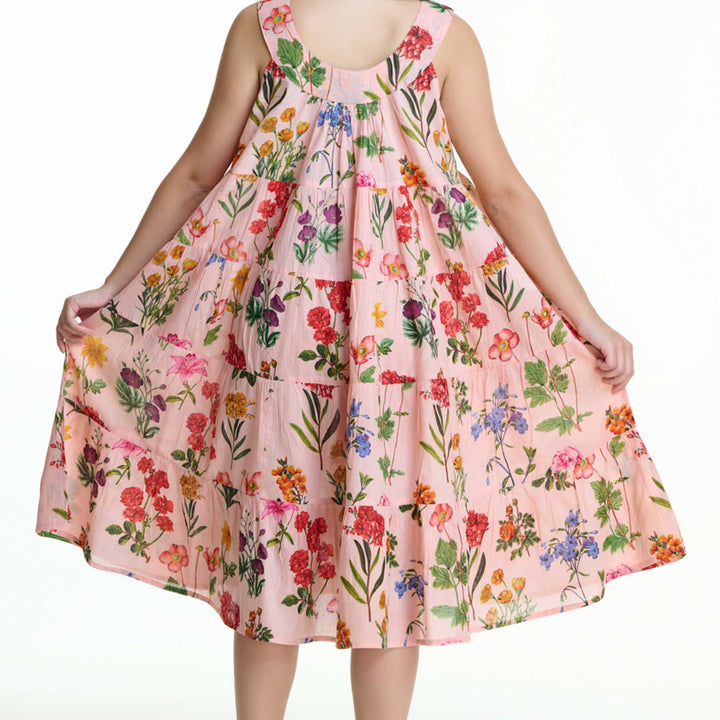 Back view of pink floral cotton nightie with tiered panels and wide straps