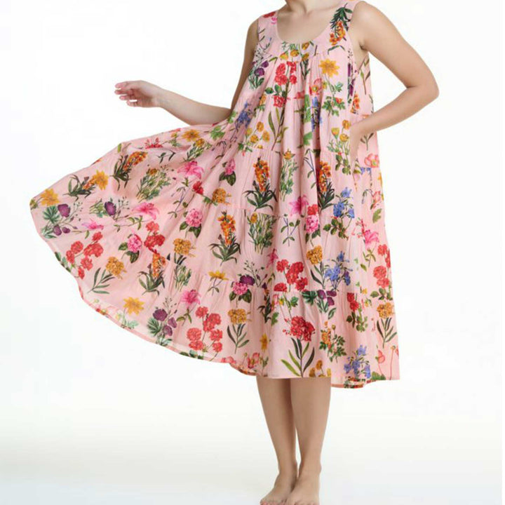 Model holding skirt of pink floral cotton nightie, revealing flowing silhouette