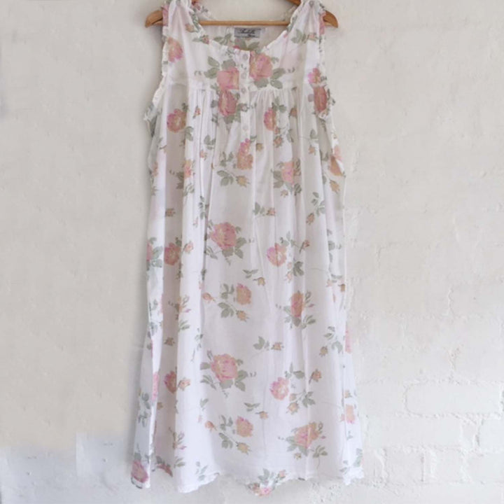 Close-up of Emma nightie showing button-front design, rose print fabric, and fine pleated detailing.