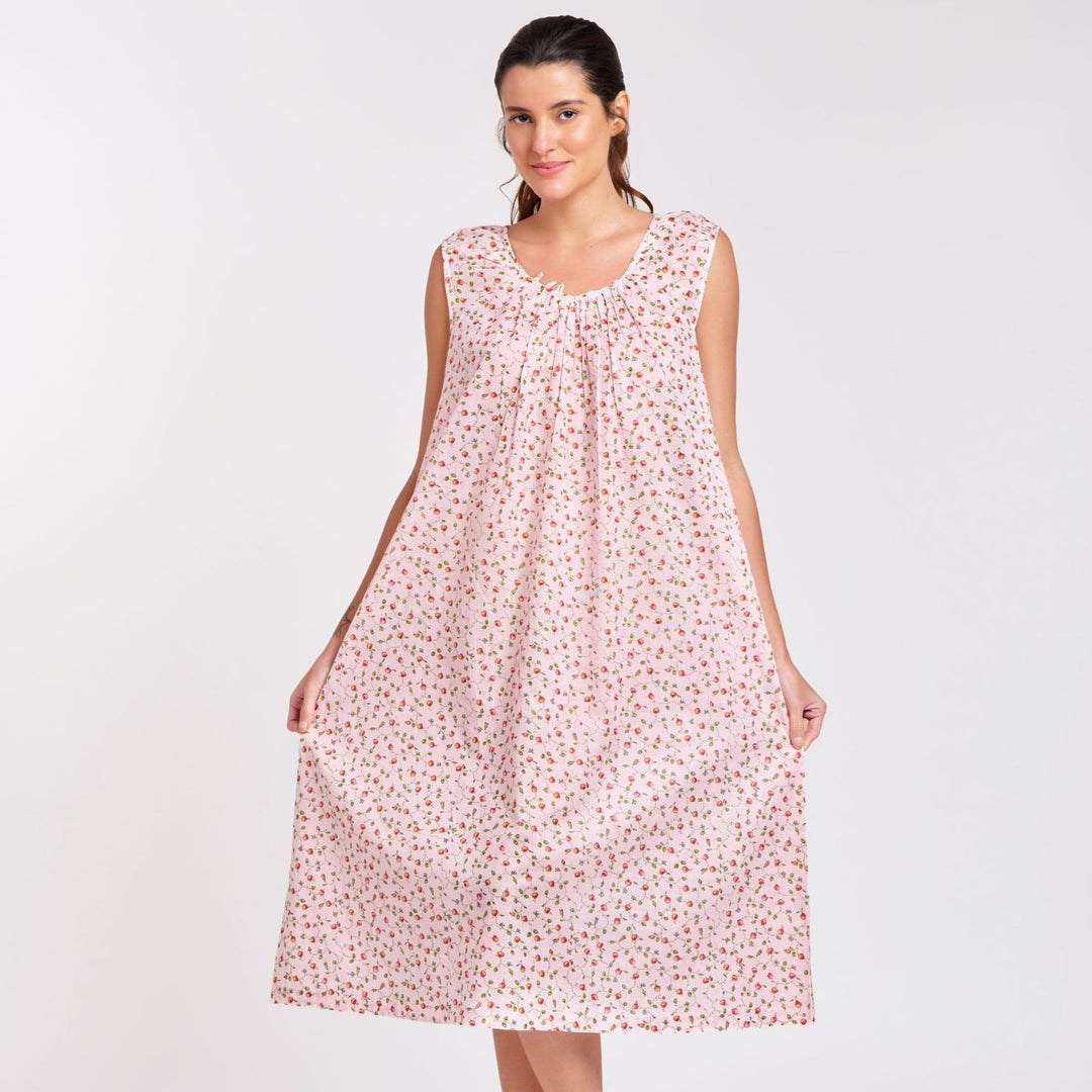 Model in airy cotton nightie with floral print, smiling and posing with relaxed fit