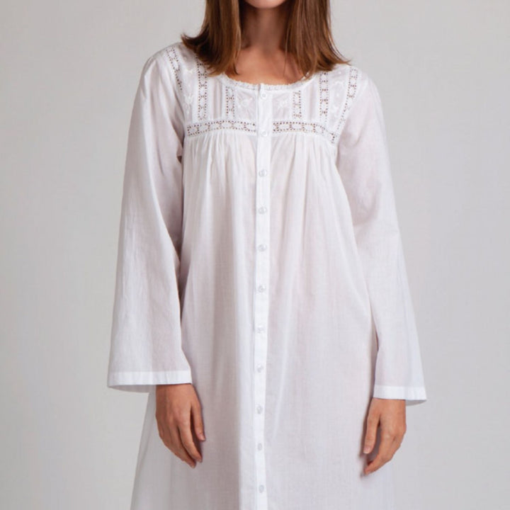 Front view of long sleeve white nightdress featuring lace detailing and buttons.