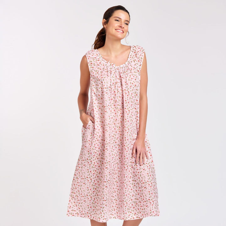Lightweight pink floral nightie with cap sleeves and pockets, shown on model