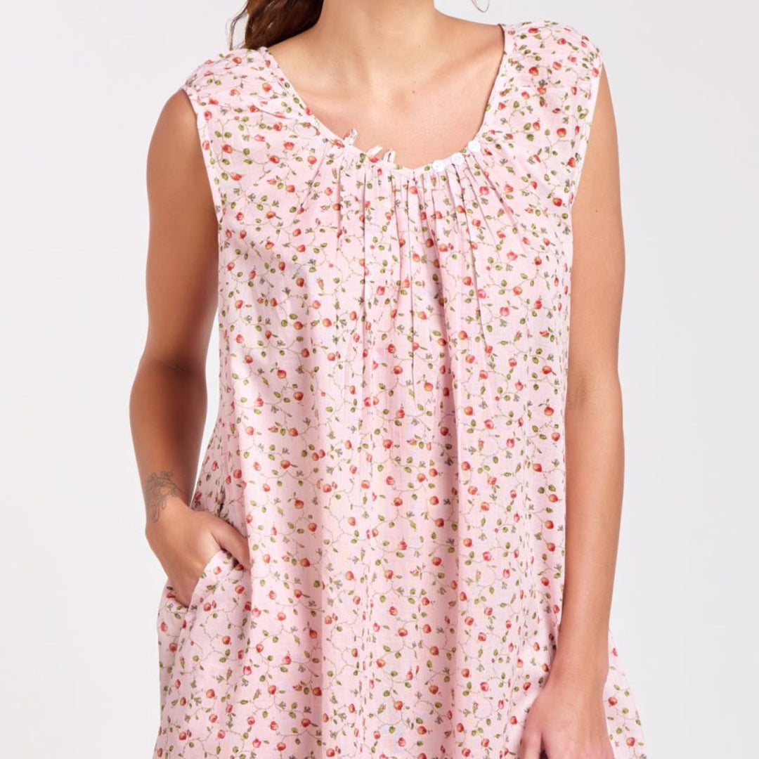 Close-up of pink rosebud print cotton nightie with gathered neckline and pocket