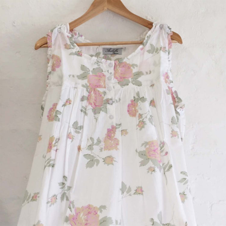Vintage-inspired nightie in white cotton with delicate pastel floral print and gathered bodice detailing.