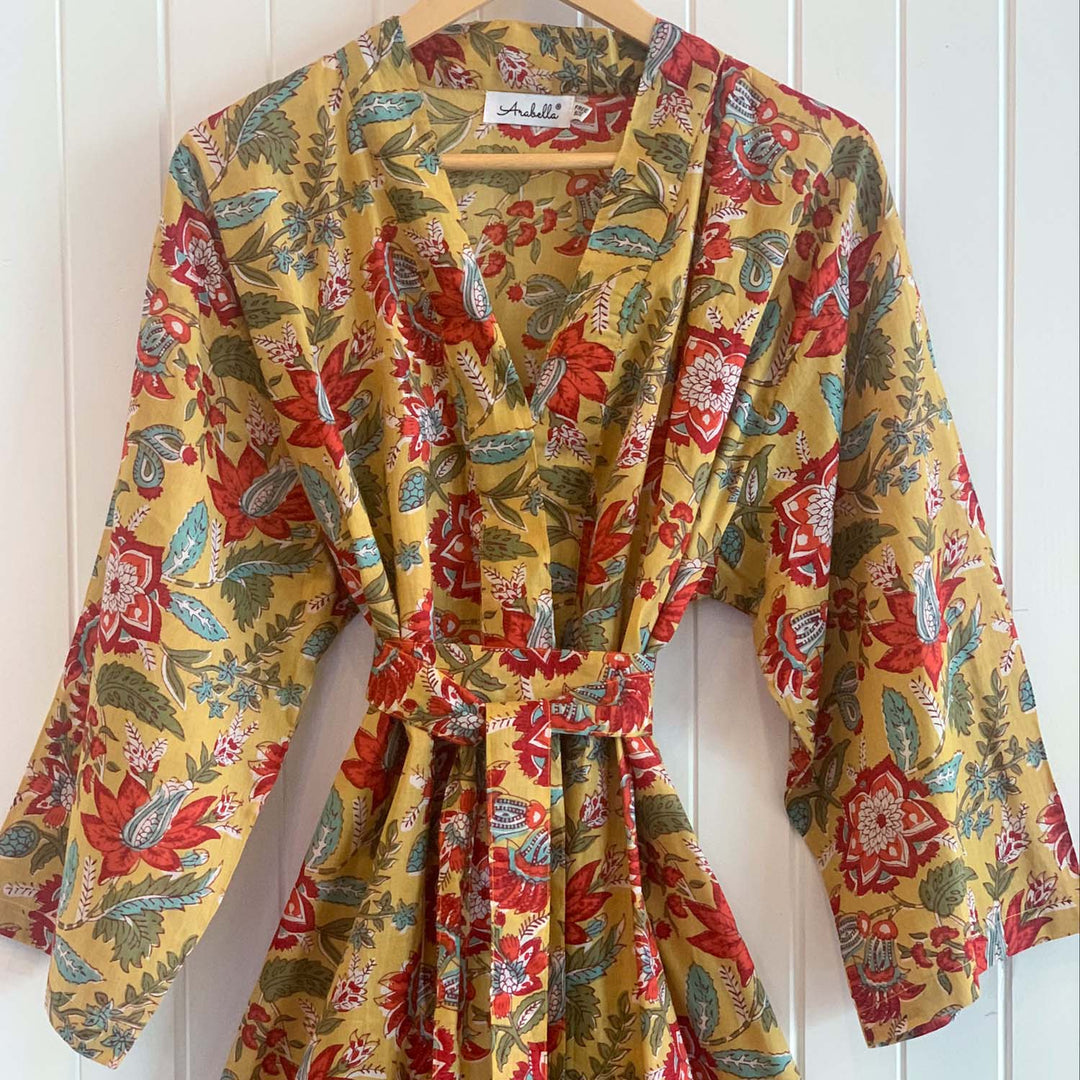 Close-up of Belinda cotton kimono tied at the waist, featuring earthy floral print and ¾ length sleeves