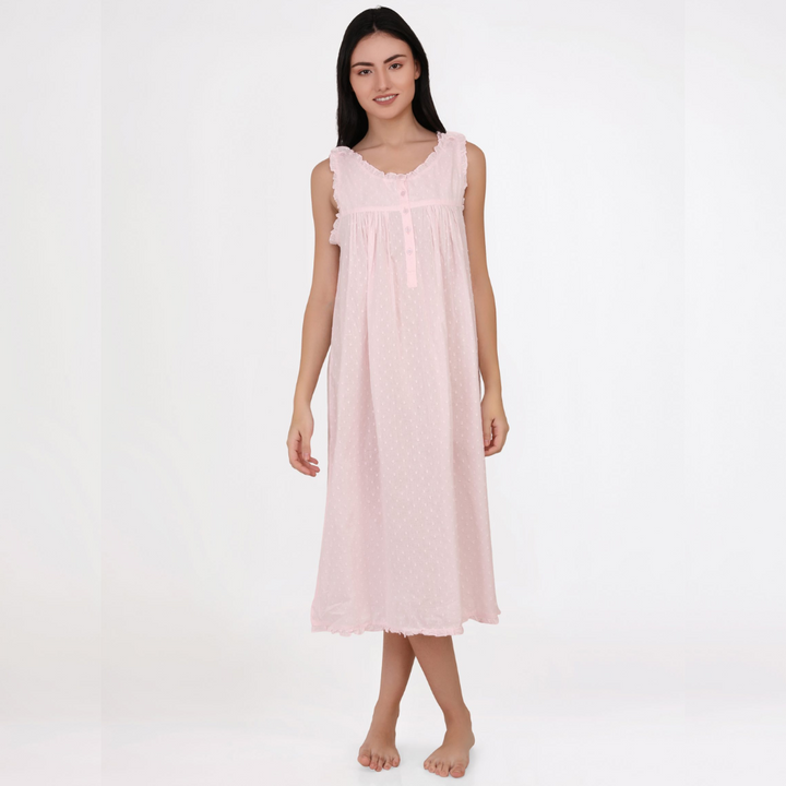 Woman wearing a pink nightgown on a white background