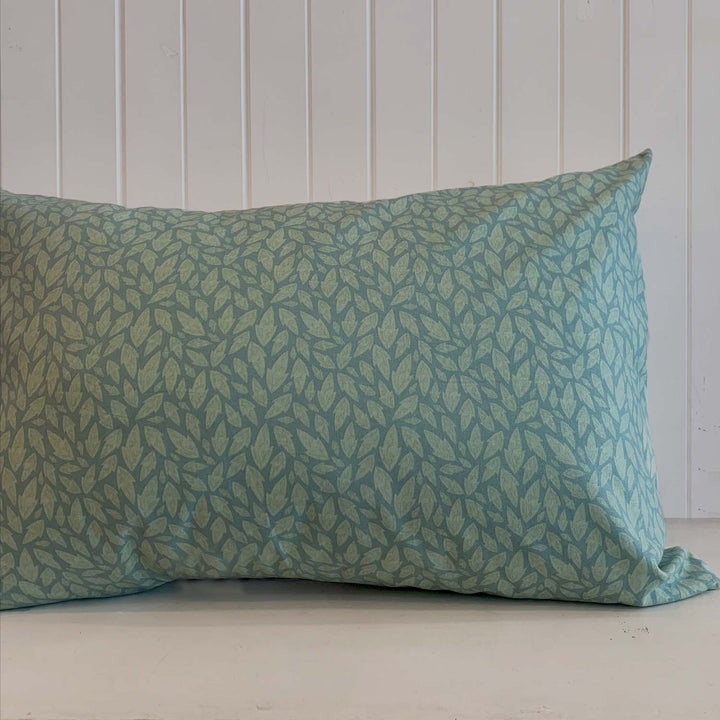 Close-up of the RE/Loved Actil Hollybush pillowcase showcasing the soft green leaf print and vintage cotton texture.