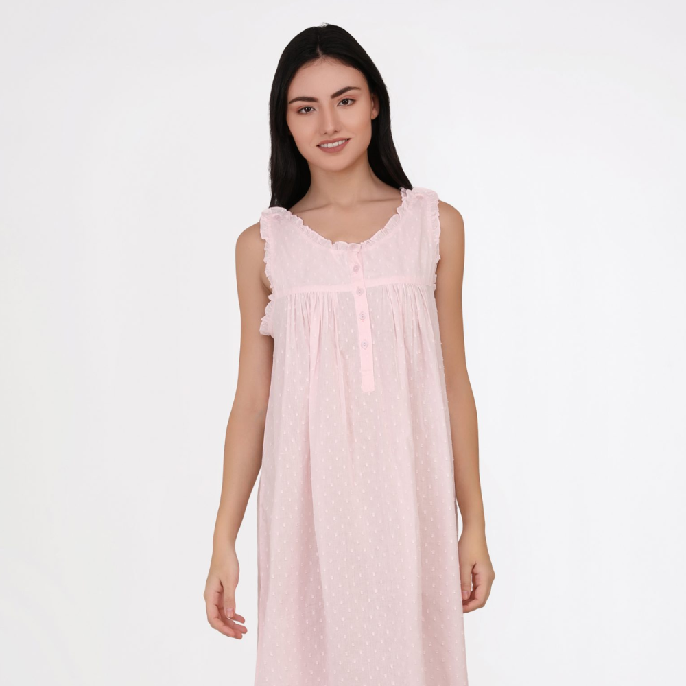 Woman wearing a pink nightgown on a white background