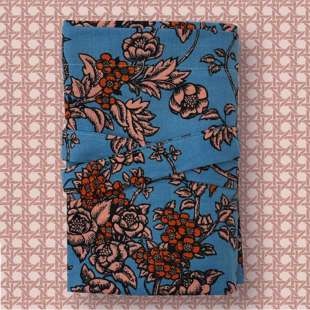 Floral-patterned fabric on a textured pink background