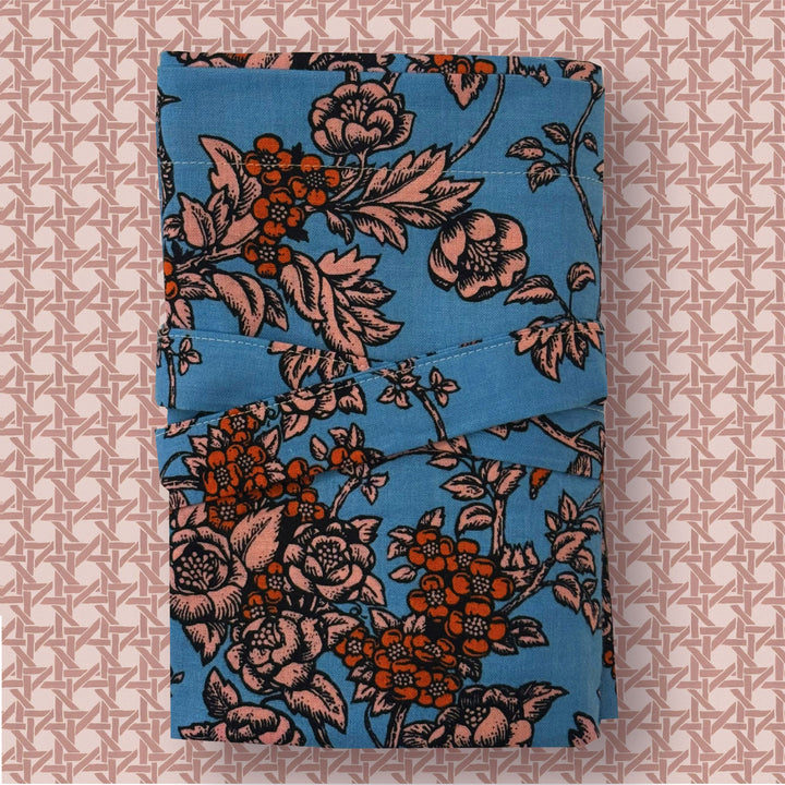 Floral-patterned fabric on a textured pink background