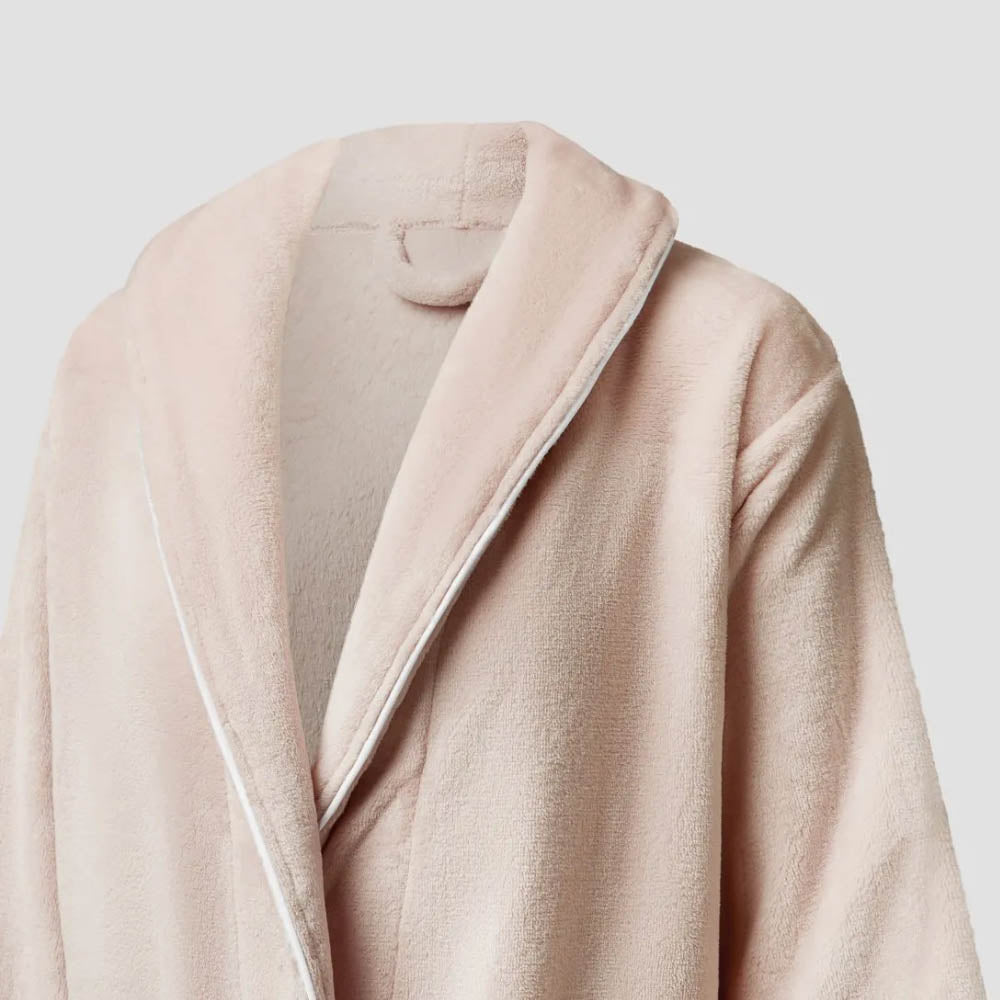 Close-up of a beige coat with a neutral background