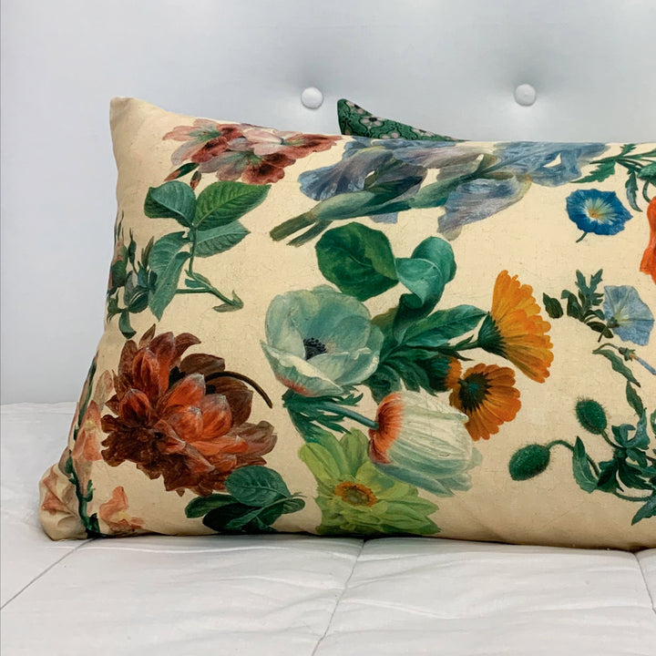 Floral-patterned pillow on a white sofa